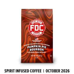 A bag of FDC Fire Department Bourbon Coffee, Pumpkin Pie Bourbon flavor, featuring a red and orange marbled design with a white FDC logo. The bag is shown against a white background with a black text banner at the bottom reading 'SPIRIT INFUSED COFFEE | OCTOBER 2026'.