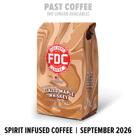 A bag of FDC Fire Department NY Glazed Maple Whiskey coffee stands on a white background with promotional text above and below. The bag is tan and brown with a red FDC logo and black text.