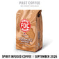 A bag of FDC Fire Department NY Glazed Maple Whiskey coffee stands on a white background with promotional text above and below. The bag is tan and brown with a red FDC logo and black text.