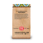 A vertical bag of Fire Dept Coffee from Guatemala, featuring a light brown wood-grain patterned design with black text and a colorful patterned ribbon at the top.