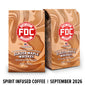 Two bags of FDC Fire Department Bar Coffee Glazed Maple Whiskey coffee with a brown liquid swirl design, shown on a white background with a black text banner at the bottom reading ’SPIRIT INFUSED COFFEE | SEPTEMBER 2026’.