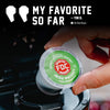A hand inserts a FDC Spirit Infused Coffee K-Cup into a coffee maker. The top of the image features a quote graphic that reads 'MY FAVORITE SO FAR - TIM D.