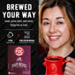 A promotional graphic for FDC Coffee Maker showing a smiling woman holding a red mug on the right, and product text plus a pod coffee maker box on the left. The left side reads ’BREWED YOUR WAY’ and includes icons and a package image for FDC Spirit Infused Coffee.