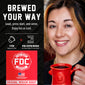 A promotional graphic for a coffee pod maker showing a smiling woman holding a red mug on the right, and product information on the left. The left side includes the text ’BREWED YOUR WAY,’ descriptive copy, icons for 1 POD suggested serving and POD coffee maker, and a red Fire Department style FDC Coffee logo panel.