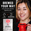Promotional graphic for FDC Brewing Company's Spirit Infused Coffee, showing a smiling woman holding a red coffee mug on the right, and product features on a black background on the left including the text 'BREWED YOUR WAY' and a package image of the coffee pods.