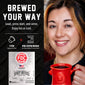 Promotional graphic for FDC Brewing Company’s Spirit Infused Coffee, showing a smiling woman holding a red coffee mug on the right, and product features on a black background on the left including the text ’BREWED YOUR WAY’ and a package image of the coffee pods.