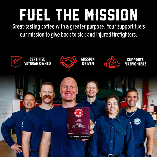A promotional graphic for FDC Coffee featuring six firefighters in blue uniforms standing in a garage-like setting, with one man holding a box of FDC Coffee Roasted Black Cherry Bourbon. Above them is a black banner with white and red text reading ’FUEL THE MISSION’ and supporting claims like ’Certified Veteran Owned’ and ’Mission Driven’.