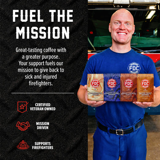 Smiling man in a blue Fire Department Coffee uniform holds four Spirit Infused Coffee bags in front of a fire truck. “Fuel the Mission” text highlights the certified veteran-owned company’s support for sick and injured firefighters.