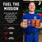Smiling man in a blue Fire Department Coffee uniform holds four Spirit Infused Coffee bags in front of a fire truck. “Fuel the Mission” text highlights the certified veteran-owned company’s support for sick and injured firefighters.