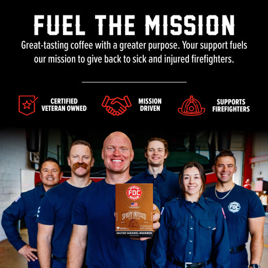 A group of smiling firefighters in navy uniforms stand in a garage-like setting while holding a box of FDC Salted Caramel Bourbon coffee. Large text at the top reads ’FUEL THE MISSION’ with supporting copy about veteran ownership and support for firefighters, plus red icons for certified veteran owned, mission driven, and supports firefighters.