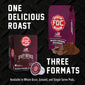 Promotional product graphic for FDC Coffee showing a whole bean box, a single-serve pod, and coffee beans and powder on a black textured background, with large text reading ’ONE DELICIOUS ROAST’ and ’THREE FORMATS’.