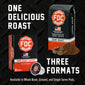 FDC Coffee Dark Roast promotional graphic showing a whole bean box, a single-serve pod, and loose coffee beans and grounds on a black textured background, with large text reading ’ONE DELICIOUS ROAST’ and ’THREE FORMATS’.