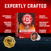 FDC Donut Shop Coffee single-serve coffee pods shown in a retail box with one pod placed in front, on a dark textured surface against a red background. Large text reads 'EXPERTLY CRAFTED' with callout phrases about sourcing, roasting, and quality.