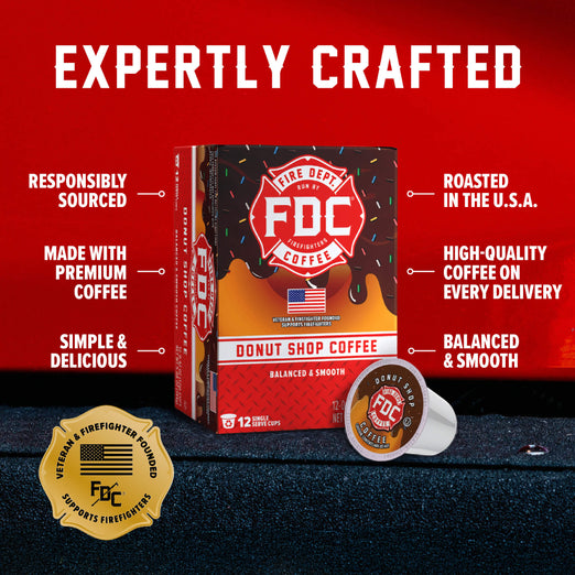 FDC Donut Shop Coffee single-serve coffee pods shown in a retail box with one pod placed in front, on a dark textured surface against a red background. Large text reads ’EXPERTLY CRAFTED’ with callout phrases about sourcing, roasting, and quality.