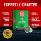 FDC Fire Department Spirit Infused Coffee box in green with a single matching coffee capsule in front, set on a dark textured surface against a red background with promotional text and a gold veteran-recognized seal.