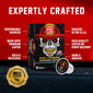 FDC Skull Crushing Espresso Coffee packaging shown on a red background with marketing text and a single coffee pod in front. The box is black with a white skull wearing a red firefighter helmet, and the pod is labeled FDC American Espresso Coffee.