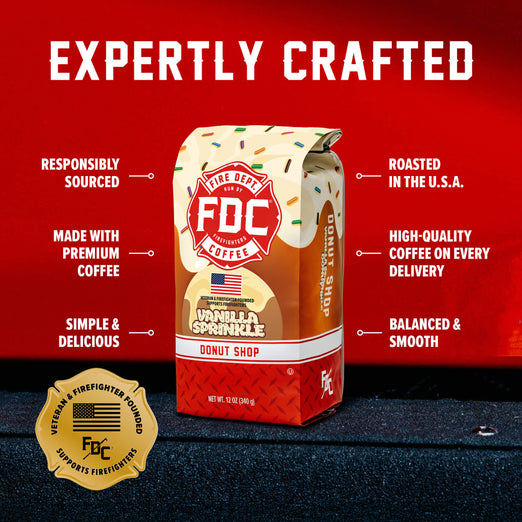 Fire Department Coffee Vanilla Sprinkle Donut Shop 12-ounce bag beneath “Expertly Crafted,” with text highlighting responsible sourcing, premium coffee, U.S. roasting, consistent quality, and balanced, smooth taste. Gold badge reads “Veteran & Firefighter Founded” and “Supports Firefighters.”