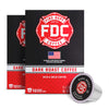 A box of FDC Fire Department Coffee Dark Roast Coffee, shown with two additional boxes behind it and a single coffee capsule in front on a plain white background.