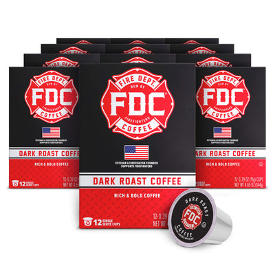 Multiple boxes of FDC Fire Department Coffee with a single cup on a white background