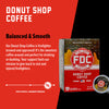 A box of Donut Shop Coffee Pods with bold text that reads. "Balanced and Smooth". A paragraph under that reads, "Our Donut Shop Coffee is firefighter brewed and approved! It's the sweetest coffee around and perfect for drinking or dunking Your support fuels our mission to give back to sick and injured firefighters."