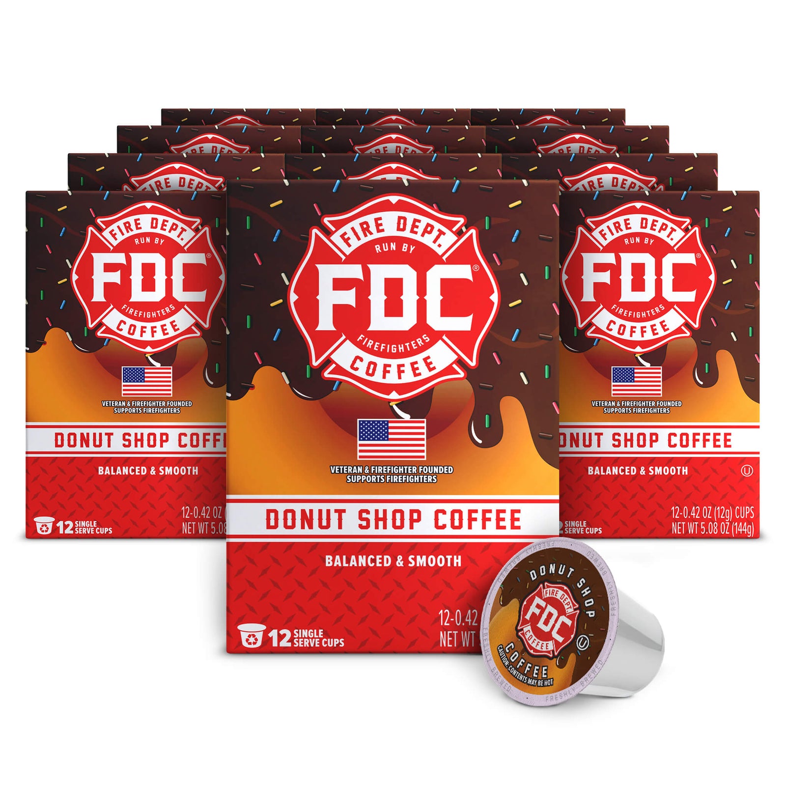 Multiple boxes of FDC Donut Shop Coffee with a single cup on a white background