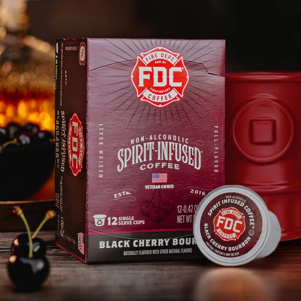 An image of the front of a box of Black Cherry Bourbon Infused Coffee Pods.