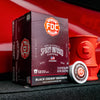 An image of a box of Black Cherry Bourbon Infused Coffee Pods resting on the front of a firetruck next to a Hydrant Mug.