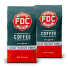 2 12 ounce packages of Fire Department Coffee's Decaf Medium Roast.