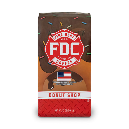 A 12 ounce package of Fire Department Coffee’s Donut Shop Coffee on a white background.