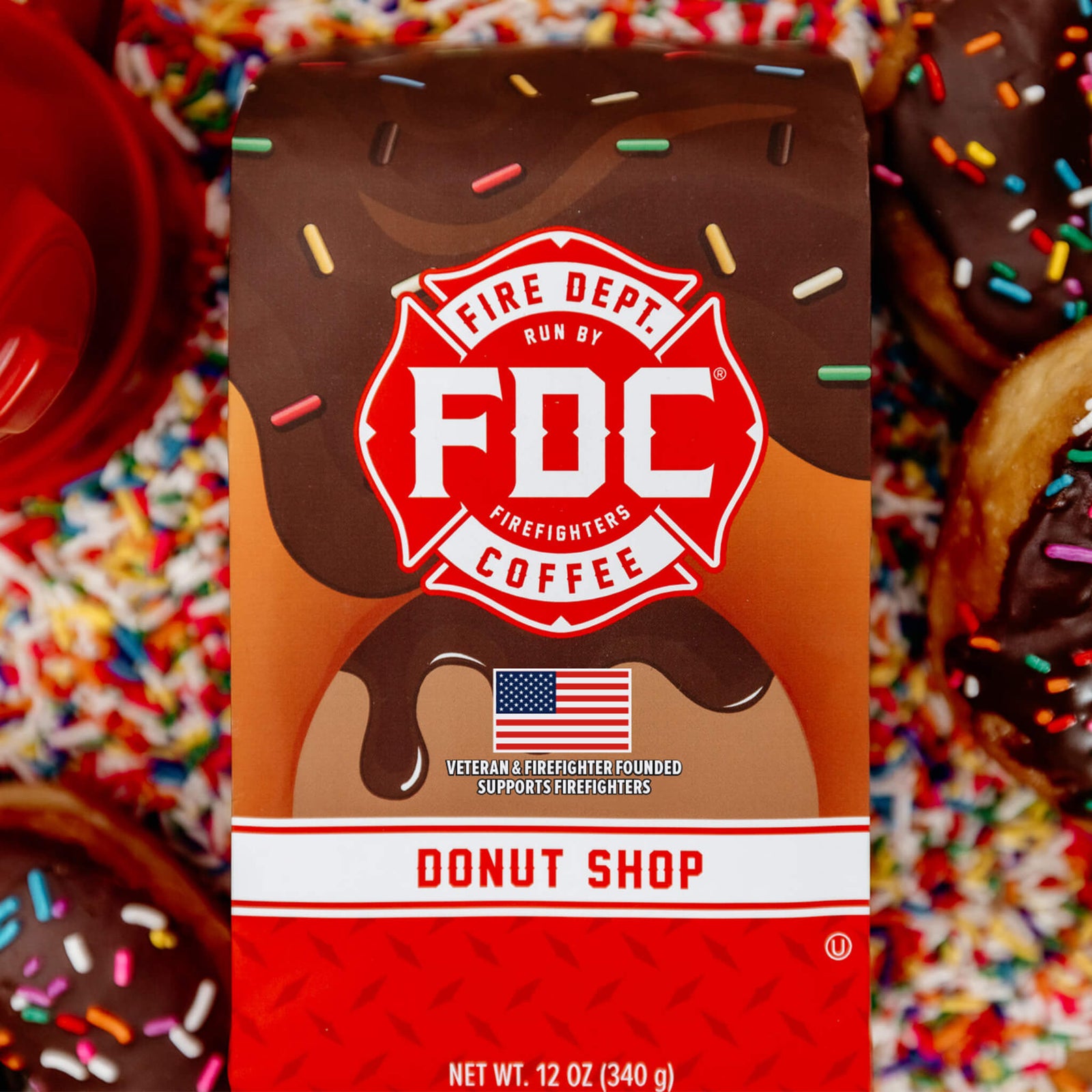 side view of twelve 12 oz bags of Donut Shop Coffee in open display box