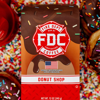 A 12 ounce package of Fire Department Coffee's Donut Shop Coffee on a white background.