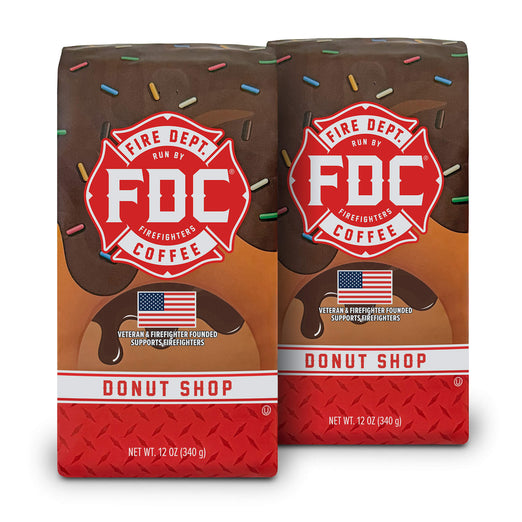 2 12-ounce packages of Fire Department Coffee’s Donut Shop Coffee Roast on a white background.