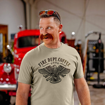 Five t-shirts in red, sand, blue, green, and gray with a US eagle design and 'Fire Dept. Coffee' text.