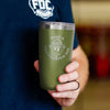 The front of the Have A Caffeinated Day Green Tumbler 20oz. Showing a retro smiley-face design.