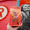 Fire Department Coffee Rockford Peaches and Cream Coffee 12 ounce bag in front of wall art of the Rockford Peaches