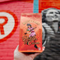 Fire Department Coffee Rockford Peaches and Cream Coffee 12 ounce bag in front of wall art of the Rockford Peaches