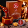 Fire Department Coffee's Salted Caramel Bourbon Infused Coffee pods packaging with a single coffee pod in front on a dark background.