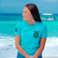 A lifestyle image of someone wearing the Shellback Shirt. The front of the shirt features the FDC pike pole logo on the chest.