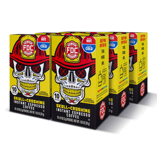 Six boxes of Skull-Crushing instant espresso coffee with a skull design on a white background