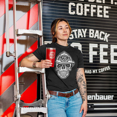 Five t-shirts with skull designs wearing firefighter hats in red, vintage white, military green, black, and heather gray.