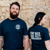 A lifestyle image of two people wearing the Stay Back Shirt in Navy. The front of the shirt features the FDC maltese cross logo in white and the back of the shirt reads, "Stay back 500 feet until I've had my coffee"