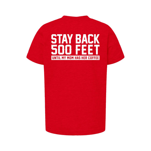 A youth-size red shirt that has the FDC maltese cross on the front and a back that reads, ”Stay back 500 feet until my mom has her coffee”