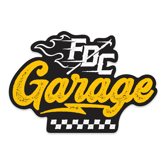 The word ”Garage” in yellow text with ”FDC” in flames above and a checkered flag design below.