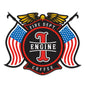 A maltese cross design with American flags on each side, a golden eagle on top and text that reads ��Engine 1” in the center.