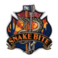 This sticker’s background is a landscape of the desert and the indigenous rattlesnake wrapped around a set of irons. The text on the sticker reads, ”Snake Bite”.