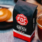 A bag of Dark Roast Coffee on a table