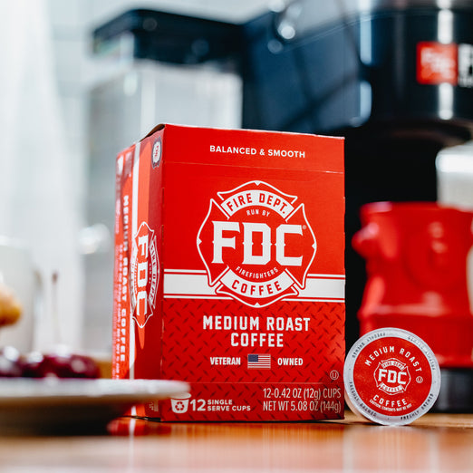 A 12 count box of Original Medium Roast Coffee Pods sitting on a table