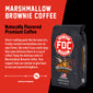 A bag of Marshmallow Brownie Coffee with bold words that read ”Naturally Flavored Premium Coffee”. A paragraph under reads, ”There’s nothing quite like the taste of a freshly roasted marshmallow over an open flame. But what if you could enjoy the same delicious flavor in a cup of coffee? Enjoy the delicious taste of Marshmallow Brownie Coffee. Your support fuels our mission to give back to sick and injured firefighters.”