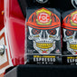 An image of two 5lb bags of Skull Crushing Espresso resting on a fire truck. 