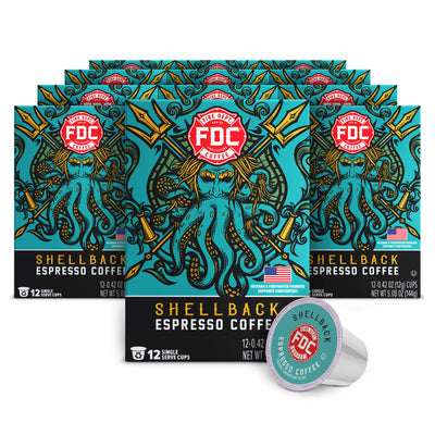Multiple boxes of FDC Shellback Espresso Coffee with a single pod in front on a white background